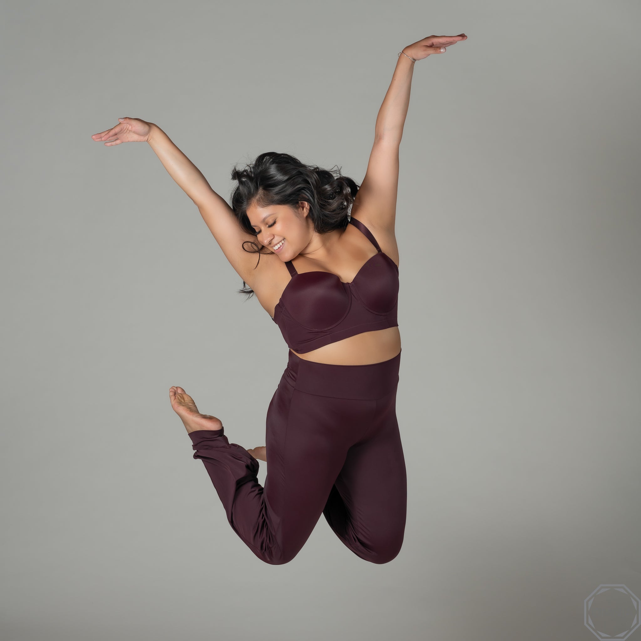 Jazmin is jumping for joy; wearing our OMNIAintimates.com 